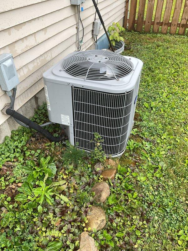 Responded to service call for 6-year-old Carrier air conditioning system not producing cold air with rising indoor temperatures. Upon arrival, performed diagnostic assessment of outdoor condenser unit and associated electrical components. Inspected condenser coils, refrigerant lines, electrical disconnect, and meter connections to identify cause of cooling failure and restore proper system operation.