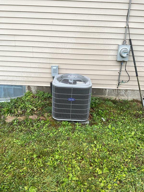 Responded to service call for 6-year-old Carrier air conditioning system not producing cold air with rising indoor temperatures. Upon arrival, performed diagnostic assessment of outdoor condenser unit and associated electrical components. Inspected condenser coils, refrigerant lines, electrical disconnect, and meter connections to identify cause of cooling failure and restore proper system operation.