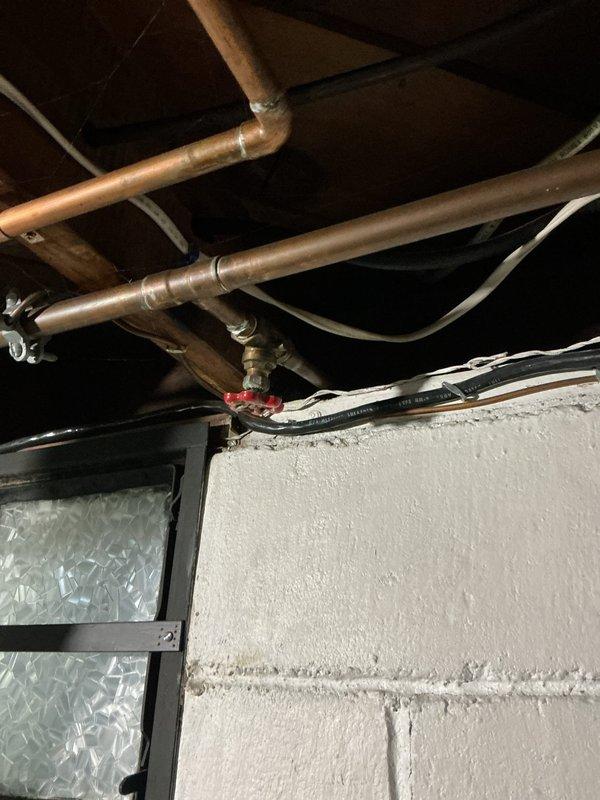 Responded to a leaking exterior hose bib shut-off valve in a 1940s-era home. Upon inspection, located the valve in the basement ceiling area controlling the outdoor spigot. Replaced the deteriorated brass shut-off valve with a new quarter-turn ball valve to eliminate the leak. Tested the system for proper operation and verified no additional leaks were present at connections or at the exterior hose bib.