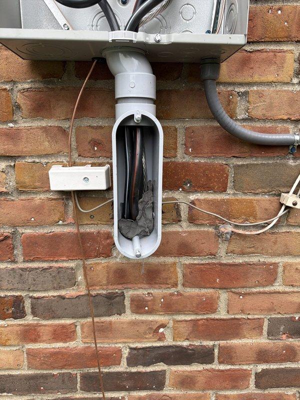 Installed new 200 amp exterior service with disconnect, running service in conduit from exterior meter to main panel. Refed existing panel with SER cable, properly separating grounds and neutrals throughout. Installed new ground rod system, waterline ground, and bonded hot water tank and water softener per code requirements. Replaced AC disconnect and installed whole home surge protection device. Upgraded main electrical panel to 200 amp capacity with proper circuit labeling and documentation for inspection approval.