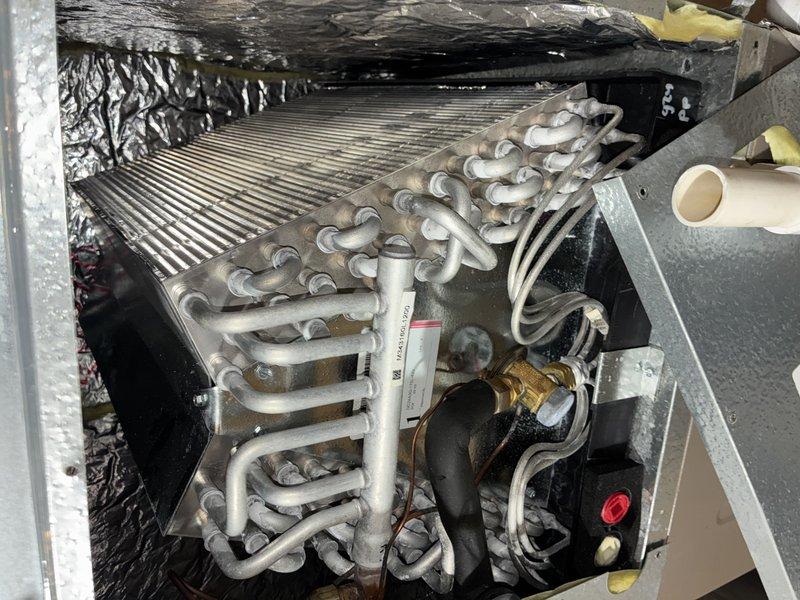 Completed comprehensive preventive maintenance inspection on two-year-old air conditioning system. Performed visual inspection of evaporator coil assembly, refrigerant lines, control boards, and electrical connections. All components found operating within normal parameters with no deficiencies noted.
