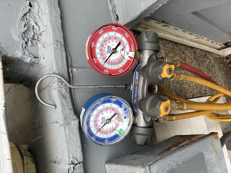 Completed MVP cooling maintenance visit on 4-year-old HVAC system. Connected refrigerant manifold gauges to measure system pressures and verify proper refrigerant charge levels. Inspected outdoor condenser unit, noting accumulated debris on protective grille and vegetation growth near base that will require monitoring to ensure adequate airflow. All pressure readings were within manufacturer specifications, and system is operating efficiently for continued cooling performance.