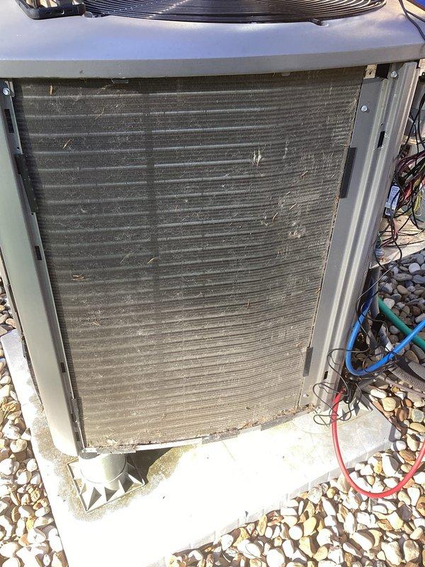 Completed MVP cooling maintenance visit on 3-year-old system. Inspected electrical disconnect box with cartridge fuses, verified proper operation and secure mounting. Evaluated outdoor condensing unit and observed heavily soiled condenser coil with significant dirt and debris accumulation restricting airflow through fins. Checked refrigerant line connections and electrical wiring routing. System operational but coil condition noted for reduced efficiency. Standard preventive maintenance performed per recurring service agreement.