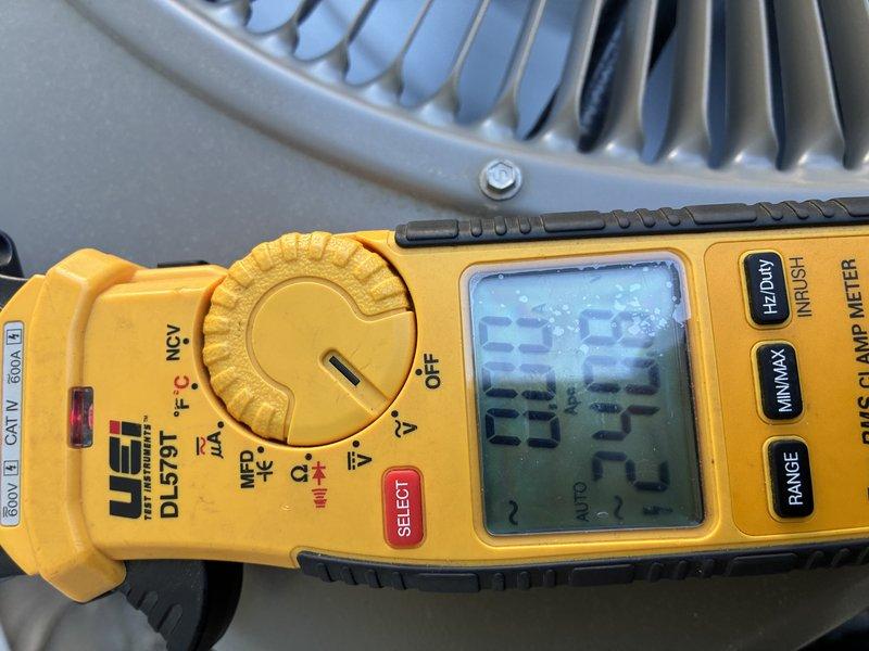 Completed preventive maintenance on residential air conditioning system. Performed electrical diagnostics with clamp meter, recording amperage readings of 23.8A and 20.5A on condenser unit. Inspected outdoor condenser unit positioned on concrete pad, verified proper airflow through top louvers, and confirmed all electrical connections and disconnect box are secure and operational.