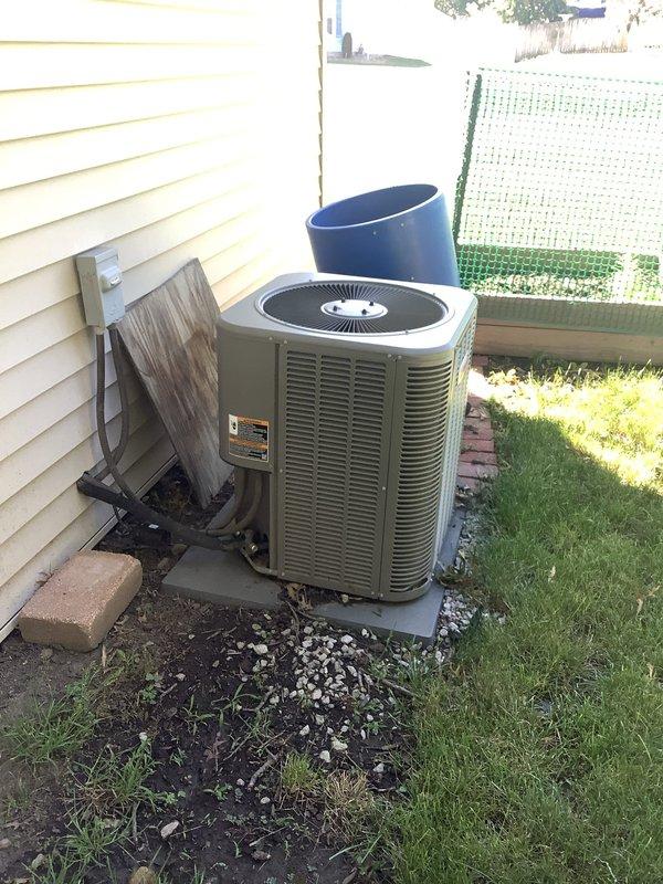 Responded to service call for 9-year-old air conditioning system not producing cold air with thermostat issues. Upon arrival, performed comprehensive diagnostic evaluation of both outdoor condenser unit and indoor air handler system. Inspected outdoor unit mounted on concrete pad, verified electrical connections at disconnect box, and assessed overall equipment condition. Proceeded to basement mechanical room to evaluate indoor furnace/air handler unit and thermostat operation. Diagnosed system malfunction, addressed thermostat communication problems, and restored proper cooling operation to the residential HVAC system.