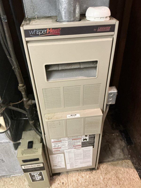 Completed estimate for replacement of 37-year-old air conditioning condenser unit and Lennox WhisperHeat furnace system. Both units are currently operational but have reached end of service life, showing visible signs of aging and weathering on outdoor components. Assessed existing outdoor condenser installation, electrical disconnect, gas meter connections, and basement furnace with ductwork to provide comprehensive replacement recommendations for complete HVAC system upgrade.