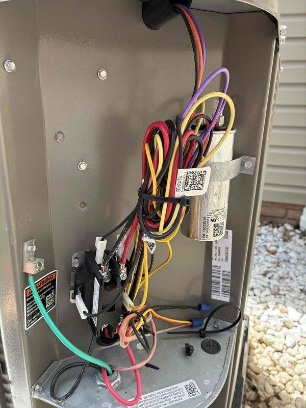 Completed routine summertime maintenance on approximately 18-month-old air conditioning unit with no reported issues. Performed standard tune-up inspection, noting condenser coil had accumulated significant dirt, dust, and debris buildup across the fins. Inspected electrical control panel and wiring harness, which appeared clean, properly organized with secure zip ties, and showed no signs of damage or corrosion.