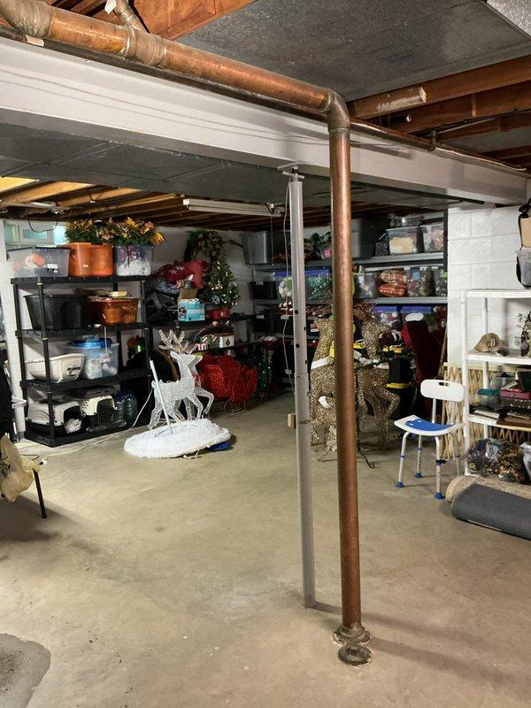 Responded to emergency call for basement drain overflow causing water pooling in basement area. Upon arrival, assessed the drainage system and identified blockage in main basement floor drain. Cleared obstruction using professional drain cleaning equipment, restoring proper water flow and drainage function. Inspected surrounding plumbing infrastructure including copper supply lines and drainage pipes to ensure no additional issues were present. Verified drain was functioning properly with no further backup or overflow occurring in the basement space.