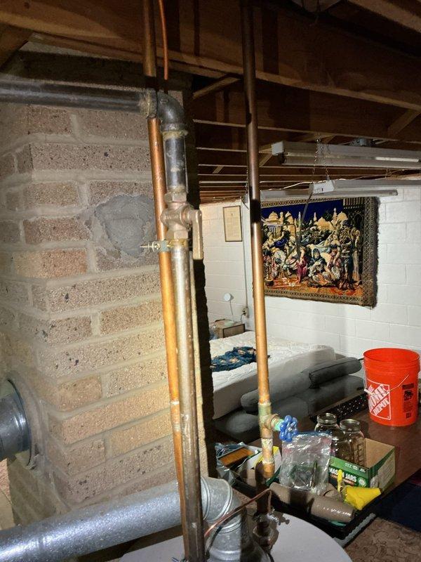 Responded to emergency call for basement drain overflow causing water pooling in basement area. Upon arrival, assessed the drainage system and identified blockage in main basement floor drain. Cleared obstruction using professional drain cleaning equipment, restoring proper water flow and drainage function. Inspected surrounding plumbing infrastructure including copper supply lines and drainage pipes to ensure no additional issues were present. Verified drain was functioning properly with no further backup or overflow occurring in the basement space.