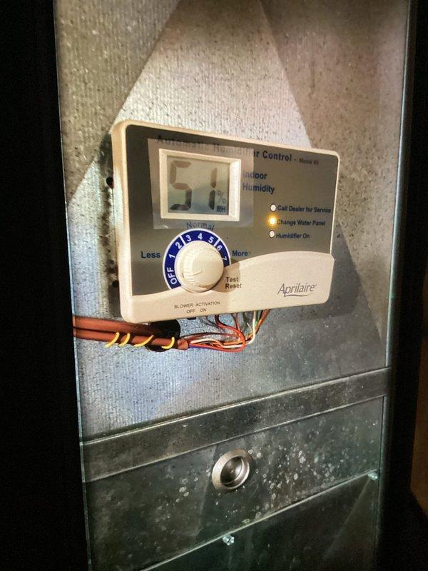 Completed MVP recurring cooling maintenance visit on residential split system. Performed comprehensive inspection of outdoor condenser unit, verified proper refrigerant line connections, and checked electrical disconnect. Inspected Aprilaire humidifier control system inside air handler, noting operational status and mineral deposits on evaporator panel indicating normal seasonal usage.