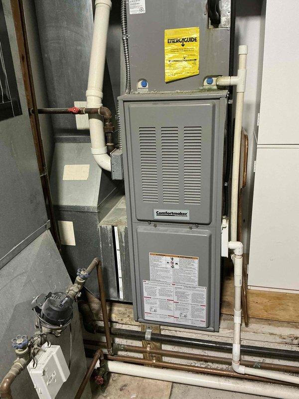 Completed on-site assessment and provided estimate for HVAC system replacement involving two separate systems: main level 20-year-old furnace and air conditioning unit, and secondary upstairs addition system approximately 10+ years old. Evaluated existing Comfortmaker furnace installation, ductwork configuration, condensate drainage system, refrigerant line routing, and humidifier integration to develop comprehensive hybrid heating system options tailored to the home's dual-zone setup.