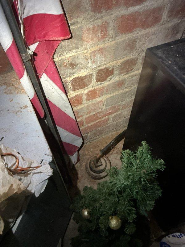 Responded to service request for backflow valve installation estimate and main drain inspection. Conducted thorough assessment of basement plumbing system, including water heater connections and existing pipe configuration along exposed brick and concrete block walls. Documented current plumbing layout with photographs to provide accurate estimate for backflow preventer installation and verified main drain accessibility for flow inspection.
