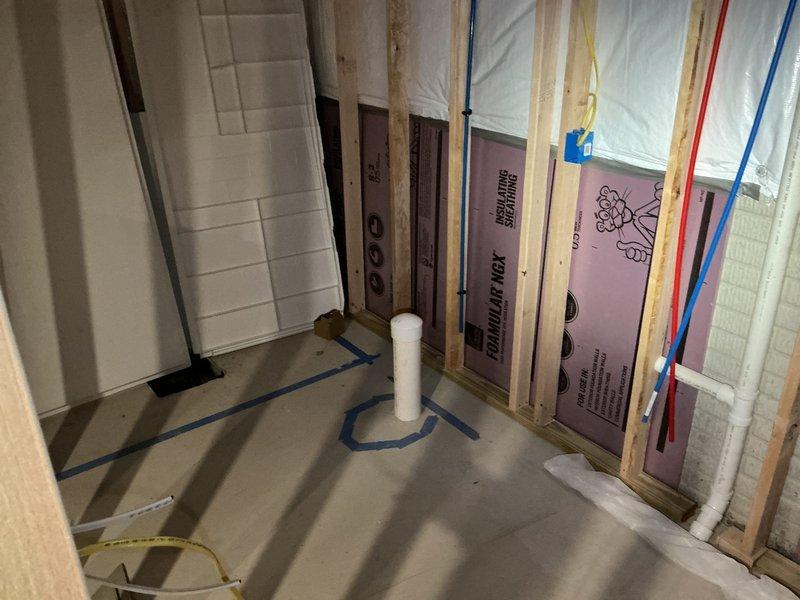 Provided second opinion estimate for basement bathroom remodeling project currently in rough-in phase. Assessed exposed plumbing fixtures requiring finish work and identified multiple capped water supply lines that need connection to fixtures upon installation. Reviewed PVC drain line installation and verified proper placement for future toilet and fixture connections.
