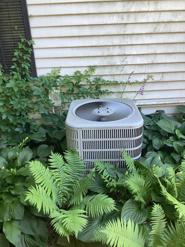 # HVAC Install - A/C & Coil

Completed installation of new residential air conditioning system including outdoor condenser unit and indoor evaporator coil. Positioned condenser unit on exterior pad against house foundation with proper clearance for airflow and service access. Connected refrigerant lines between outdoor condenser and indoor coil component. Installed evaporator coil in conjunction with existing furnace/air handler system in basement utility area. Ran and secured refrigerant linesets, electrical wiring, and condensate drain lines per manufacturer specifications. Verified proper electrical connections at disconnect box and system controls. Tested system startup, checked refrigerant charge levels, and confirmed proper airflow through ductwork. System operating within normal parameters with adequate cooling capacity.
