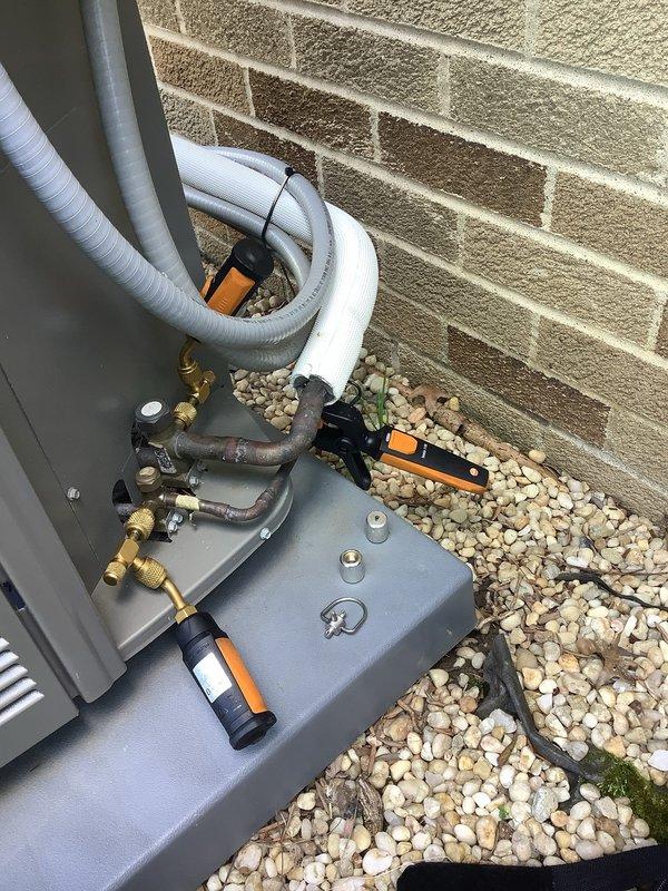 Completed MVP cooling maintenance visit on 3-year-old residential air conditioning system. Performed comprehensive inspection of outdoor condenser unit, verified refrigerant pressures and temperatures using digital gauges, checked all copper line connections and brass fittings for proper operation, and confirmed system is operating within manufacturer specifications for the cooling season.