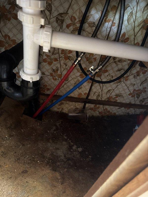 Completed full repipe of all water lines in mobile home. Removed and replaced existing polybutylene piping throughout the structure, tying new lines back to existing polybutylene in living space at shower, tub, and laundry box connection points. Installed new shut-off valves and supply lines to all sinks and toilets. Work performed from beneath the mobile home, requiring removal of underbelly access. All plumbing connections tested and verified operational upon completion of two-day installation.