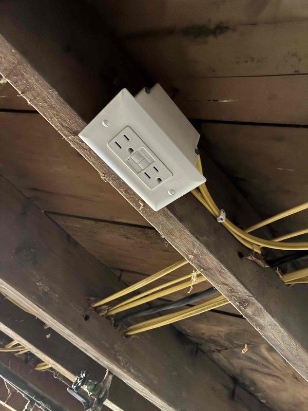 Replaced underground electrical circuit to aerated septic system control panel by hand-digging 33-foot trench to 18-inch depth to avoid existing septic infrastructure. Removed improperly installed 12-2 Romex wiring that was buried underground without proper rating and replaced with THHN conductors run through conduit for entire length. Installed junction box in basement with proper connections from existing Romex to new underground circuit, routed through seal plate into exterior bell box for code-compliant access. Replaced aging exterior electrical service. Tested aerator system for proper operation upon completion.