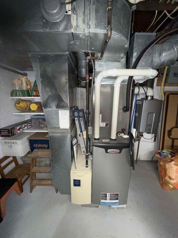 Completed preventative maintenance cooling visit on 6-year-old residential air conditioning system. Inspected furnace, air handler, and associated components including condensate drain lines, ductwork connections, and control board with DIP switch configurations. System operational and ready for cooling season.