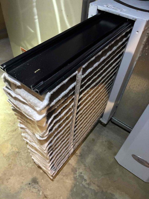 Completed scheduled MVP cooling maintenance on 8-year-old residential HVAC system. Performed comprehensive inspection of Lennox furnace and air handler assembly, including evaporator coil which showed significant accumulation of dust, lint, and debris on fin surfaces requiring attention. Verified proper operation of all system components, checked refrigerant levels, and ensured venting and ductwork connections were secure and functioning correctly.