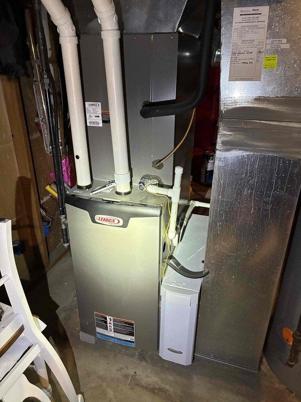 Completed scheduled MVP cooling maintenance on 8-year-old residential HVAC system. Performed comprehensive inspection of Lennox furnace and air handler assembly, including evaporator coil which showed significant accumulation of dust, lint, and debris on fin surfaces requiring attention. Verified proper operation of all system components, checked refrigerant levels, and ensured venting and ductwork connections were secure and functioning correctly.