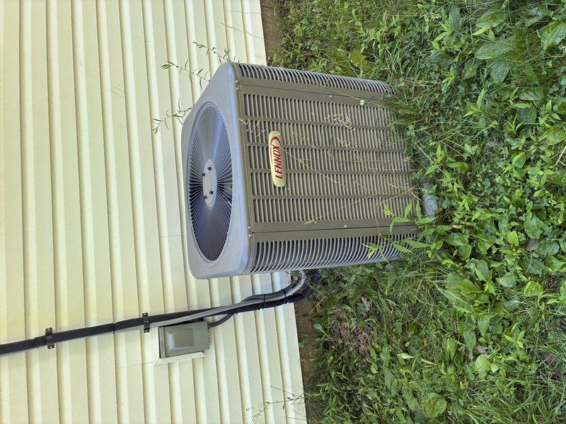 Completed scheduled MVP cooling maintenance visit on Lennox outdoor condenser unit. Performed comprehensive system inspection including visual examination of electrical components, capacitor, wiring connections, and heat exchanger coils. All components found to be in proper working condition with connections secure and intact. Documented equipment condition through photographic records showing unit exterior, internal electrical compartment, and surrounding installation area. Noted vegetation growth around unit base that may benefit from clearance to maintain optimal airflow and access for future service.