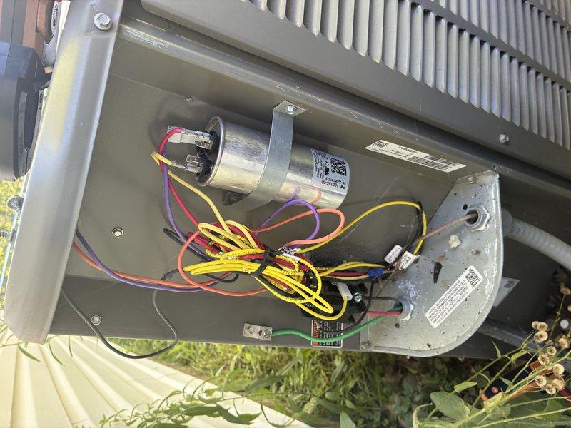 Completed scheduled MVP cooling maintenance visit on Lennox outdoor condenser unit. Performed comprehensive system inspection including visual examination of electrical components, capacitor, wiring connections, and heat exchanger coils. All components found to be in proper working condition with connections secure and intact. Documented equipment condition through photographic records showing unit exterior, internal electrical compartment, and surrounding installation area. Noted vegetation growth around unit base that may benefit from clearance to maintain optimal airflow and access for future service.