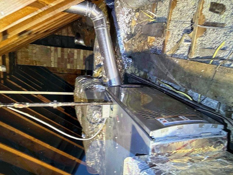 Conducted on-site evaluation for complete HVAC system replacement of an 11-year-old unit. Assessed existing air handler located in attic space with reflective insulation and connected ductwork, along with exterior condensing unit positioned on concrete pad with proper clearances. Documented current system configuration including metallic ductwork connections and refrigerant line routing through exterior wall. Provided comprehensive replacement estimate and awaiting customer confirmation to proceed with installation.