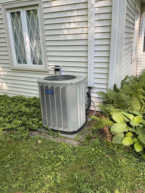 Conducted on-site evaluation for complete HVAC system replacement of an 11-year-old unit. Assessed existing air handler located in attic space with reflective insulation and connected ductwork, along with exterior condensing unit positioned on concrete pad with proper clearances. Documented current system configuration including metallic ductwork connections and refrigerant line routing through exterior wall. Provided comprehensive replacement estimate and awaiting customer confirmation to proceed with installation.