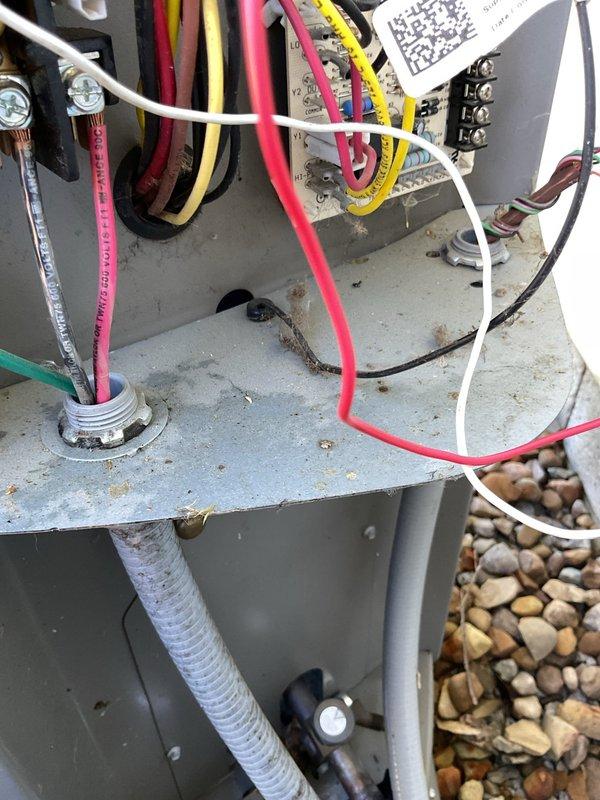 Responded to service call for non-operational heat pump and air exchanger system. Upon arrival, inspected three-year-old outdoor heat pump unit and associated electrical connections. Performed diagnostic evaluation of control panel wiring, terminal connections, and power supply circuits. Examined refrigerant line connections, unit mounting, and overall system condition. Documented equipment specifications and current operational status through visual inspection of both outdoor condensing unit and electrical control components for troubleshooting purposes.