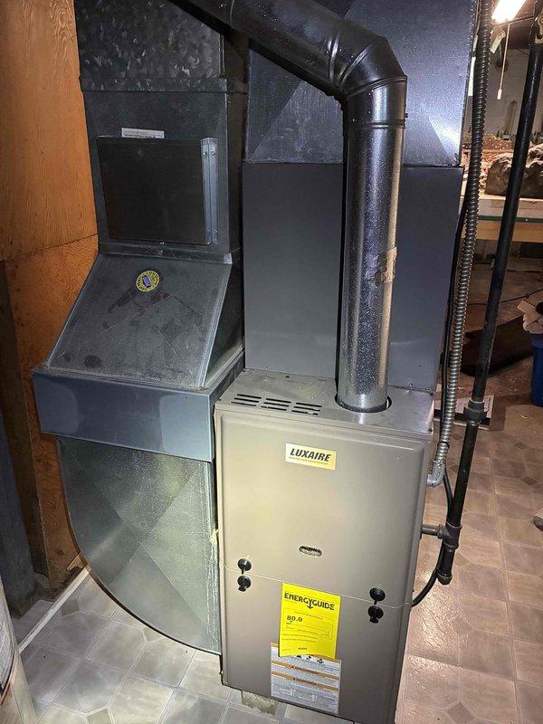 Completed annual air conditioning tune-up on six-year-old Luxaire HVAC system. Performed comprehensive inspection of outdoor condenser unit including electrical contactors, capacitor, and all wiring connections; verified proper operation of indoor air handler. Installed new air filter per customer request and confirmed system operating within normal parameters with no deficiencies noted.