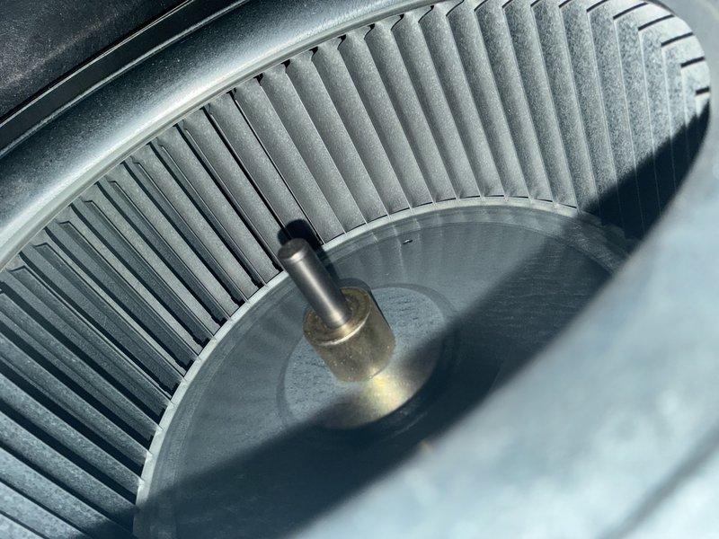 Performed preventative maintenance on 16-year-old air conditioning system. Inspected and documented blower assembly showing moderate dust accumulation on squirrel cage fan blades, verified electrical connections and capacitor condition within condensing unit. All components operational at time of inspection.