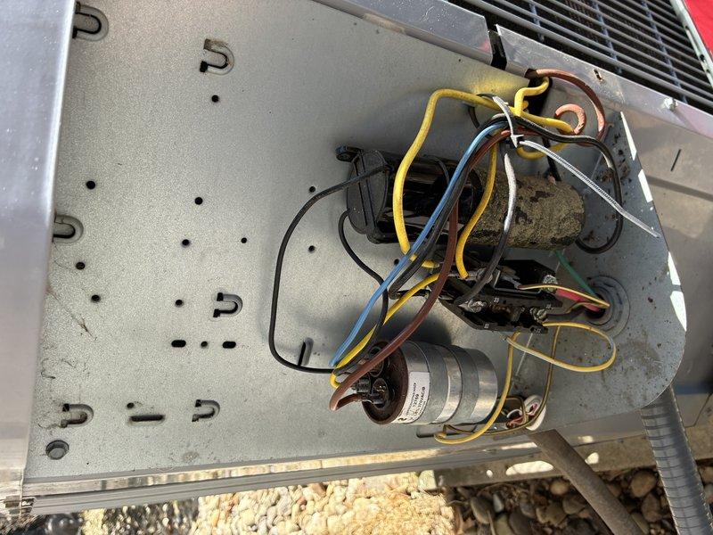 Performed preventative maintenance on 16-year-old air conditioning system. Inspected and documented blower assembly showing moderate dust accumulation on squirrel cage fan blades, verified electrical connections and capacitor condition within condensing unit. All components operational at time of inspection.
