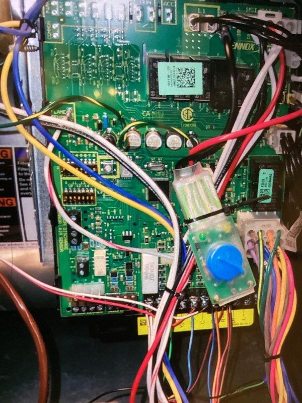 Completed MVP cooling maintenance visit as requested. Inspected and photographed HVAC system components including Aprilaire humidifier control panel displaying proper operational status at 58% humidity level with dial set to normal position. Verified control board functionality and documented wiring connections showing multiple colored conductors properly terminated to circuit board terminals. All electronic components, integrated circuits, and connector housings found in acceptable working condition with no visible signs of damage or overheating. System operating within normal parameters at time of service.