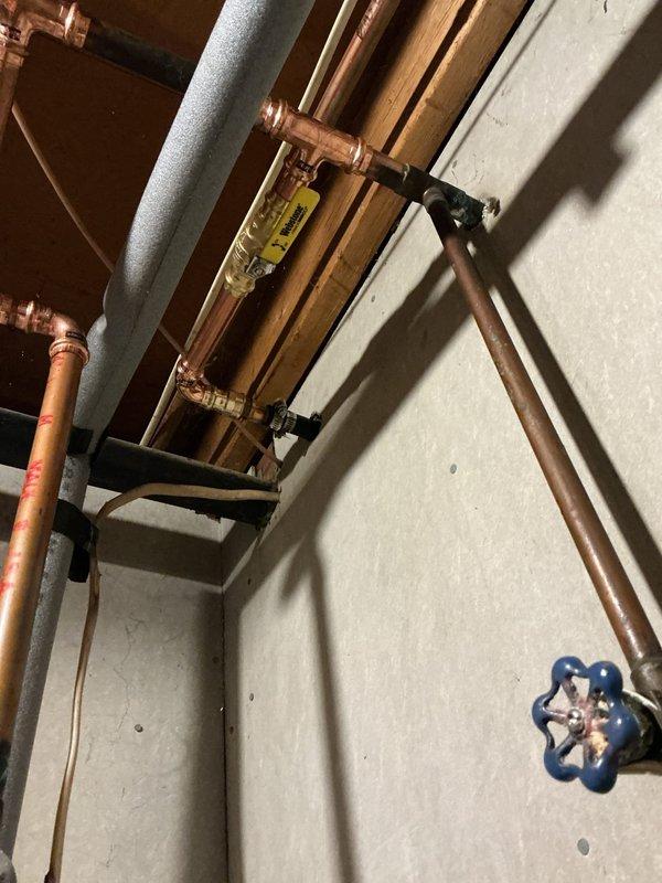 Completed warranty repair by reattaching separated water line sections using copper pipe fittings and connections. Retrieved necessary parts from will call and reinstalled piping infrastructure to restore proper water flow. All connections were secured and tested to ensure leak-free operation of the plumbing system.