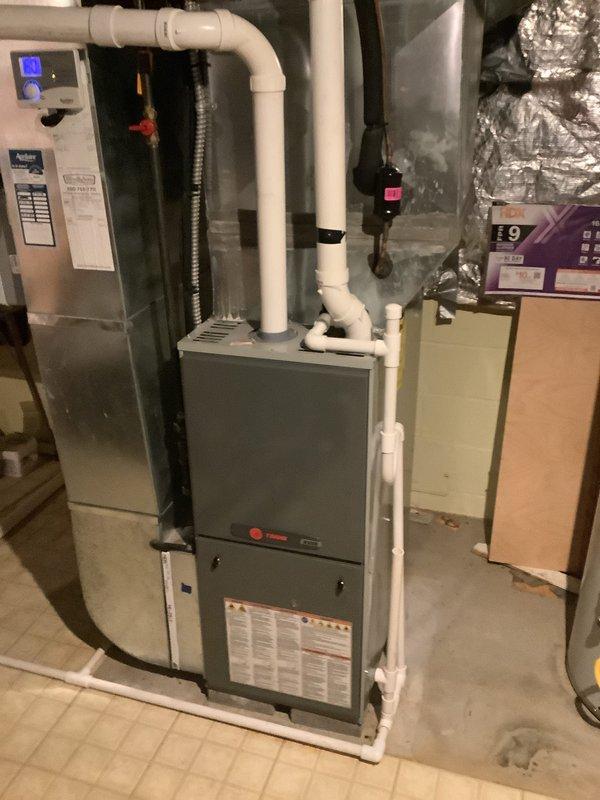 Completed installation of high-efficiency 90% AFUE furnace system in residential basement location. Installed new furnace unit with proper PVC venting configuration, connected to existing ductwork distribution system, and verified all electrical connections and gas line hookups. Performed initial startup procedures, confirmed proper ignition sequence operation, and conducted temperature differential measurements using calibrated multi-probe instrumentation to ensure system is operating within manufacturer specifications.