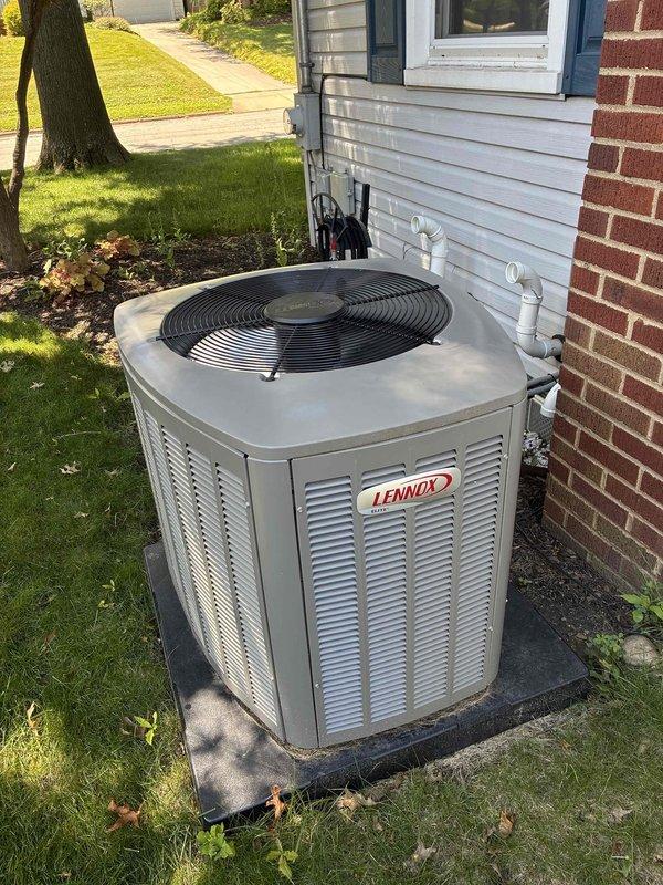 Completed annual MVP cooling maintenance visit on 1-year-old Lennox outdoor condensing unit. Performed comprehensive system inspection including visual examination of cabinet condition, refrigerant line connections, and electrical conduit mounting. Verified unit positioning on concrete pad and proper drainage. Inspected AprilAire filtration system with V-configuration pleated filters, noting moderate dust accumulation consistent with normal operation. All components operating within manufacturer specifications with no deficiencies requiring immediate attention.