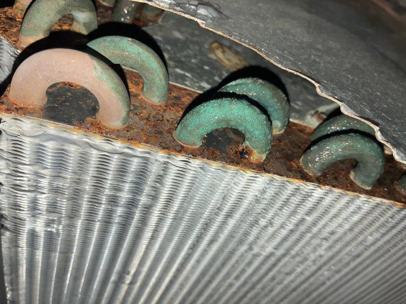 Completed MVP recurring cooling maintenance visit on residential HVAC system. Performed comprehensive inspection of outdoor condensing unit, including examination of electrical disconnect switch and service panel. Inspected condenser coil fins and mounting hardware, noting age-related wear and corrosion on base components. Documented equipment condition through photographic records. All critical operational components verified and system confirmed functional for continued service.