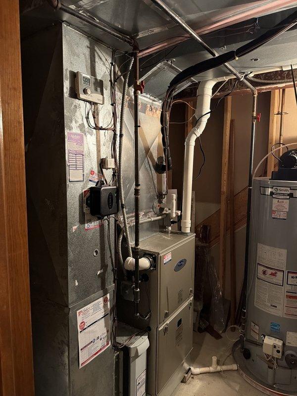 Completed first-time startup and commissioning of newly installed air conditioning system with matching evaporator coil. Verified proper refrigerant line installation, electrical connections at outdoor disconnect, and confirmed system operation with indoor air handler integration. All components tested and operational, with unit positioned per manufacturer specifications for adequate airflow clearance.