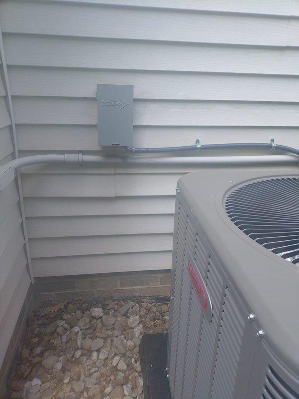 Completed first-time startup and commissioning of newly installed air conditioning system with matching evaporator coil. Verified proper refrigerant line installation, electrical connections at outdoor disconnect, and confirmed system operation with indoor air handler integration. All components tested and operational, with unit positioned per manufacturer specifications for adequate airflow clearance.