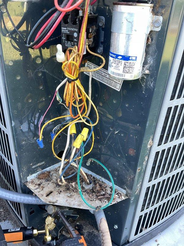 # HVAC Cooling Maintenance Completed

Performed comprehensive cooling system maintenance on residential air conditioning unit. Conducted thorough inspection of electrical components, revealing severely corroded capacitor with deteriorated top surface and aged wiring connections. Assessed overall system condition, noting significant dust and debris accumulation throughout cabinet interior indicating extended service interval. Evaluated all electrical connections, refrigerant lines, and mechanical components. System showed normal environmental wear consistent with outdoor installation and extended operation period. Documented component conditions with detailed photography for service records and future reference.