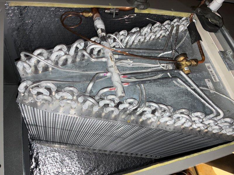 Completed comprehensive cooling maintenance tune-up on HVAC system. Performed thorough inspection of evaporator coil assembly and blower unit, confirming all components in proper working condition with no visible damage, excessive wear, or debris accumulation. System tested and verified operational upon completion.