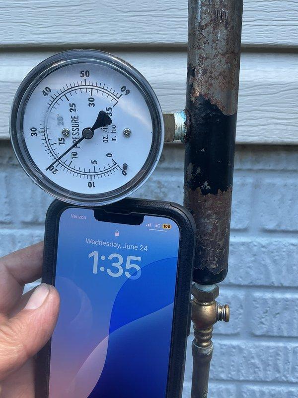 Performed pressure test on natural gas system to identify potential leak following previous service visit. Natural gas supply to property was shut off at time of arrival for safety. Connected pressure gauge to gas piping system and conducted air pressure test to isolate and verify integrity of gas lines. Monitored gauge readings over test period to determine if pressure loss indicated leak in system or if issue was unrelated to prior work completed.