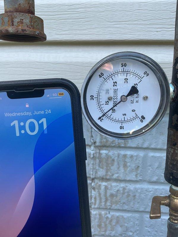 Performed pressure test on natural gas system to identify potential leak following previous service visit. Natural gas supply to property was shut off at time of arrival for safety. Connected pressure gauge to gas piping system and conducted air pressure test to isolate and verify integrity of gas lines. Monitored gauge readings over test period to determine if pressure loss indicated leak in system or if issue was unrelated to prior work completed.