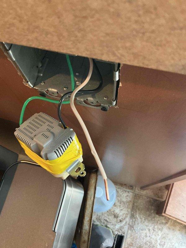 Responded to callback for repeatedly tripping breaker on outlet circuit installed earlier this year. Inspected electrical panel and traced circuit to under-cabinet outlet installation. Identified improper wiring connection at the yellow GFCI device causing intermittent ground fault condition. Corrected wire terminations at device, verified proper grounding to green equipment ground conductor, and confirmed secure connections at panel breaker. Tested circuit under load, reset breaker, and verified stable operation with no further tripping.