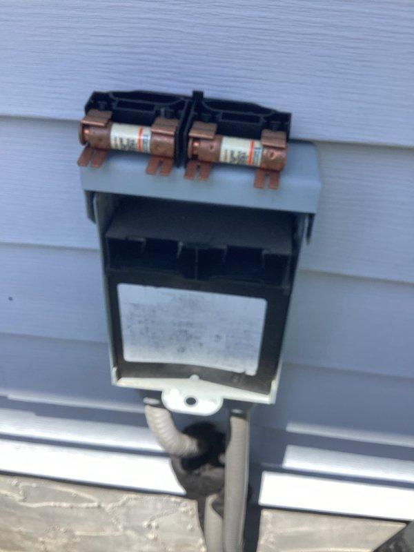 Performed comprehensive air conditioning tune-up on five-year-old cooling system with no reported issues. Completed full system inspection including electrical disconnect box examination, verified fuse integrity, and assessed all accessible components for proper operation and seasonal readiness. Unit found to be functioning within normal parameters with all safety devices operational.