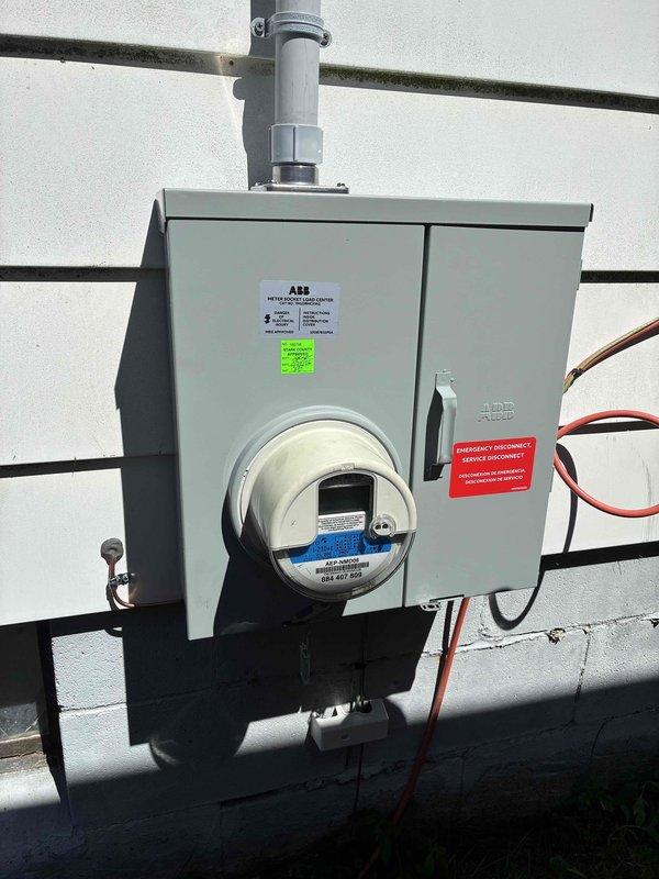 Completed 100A electrical service upgrade including installation of new exterior meter enclosure with integrated emergency disconnect switch per 2023 NEC requirements. Updated main service grounding system to current code standards and installed whole home surge protection device. Verified proper clearances and functionality of all new equipment, with meter base and disconnect properly labeled for emergency access.