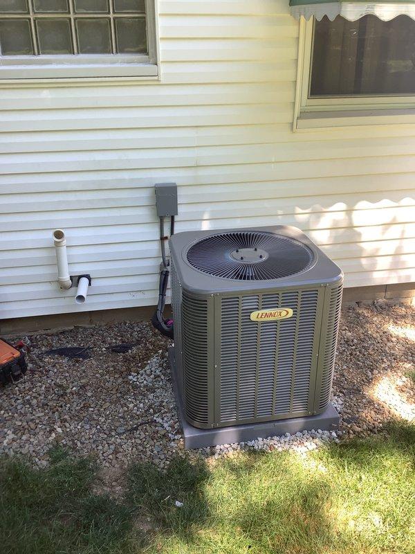 Completed installation of Lennox air conditioning system with matching evaporator coil. Installed outdoor condensing unit on concrete pad with proper clearances, mounted electrical disconnect box, and ran refrigerant lines to indoor air handler. Indoor evaporator coil was installed adjacent to existing Lennox furnace in basement mechanical room, with copper refrigerant lines properly brazed and insulated. Connected condensate drain line with PVC piping routed to exterior. System was evacuated, charged to manufacturer specifications, and tested for proper operation. All electrical connections completed per code requirements and system confirmed operational with proper airflow and temperature differential.