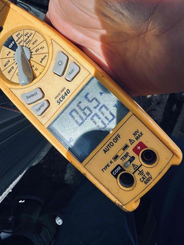 Completed comprehensive air conditioning maintenance on an eight-year-old HVAC system during morning service call. Performed full system inspection including electrical connections, control board diagnostics, and voltage measurements using calibrated multimeter, recording 26.5V at tested terminals. Inspected internal wiring harness and connections within air handler compartment, verified proper wire routing and terminal security for yellow, red, black, white, and green conductors. Cleaned and serviced unit components, checked manufacturer service notes on ZAB-PRO system specifications, and implemented recommended service upgrades previously documented in customer file. All electrical components tested within normal operating parameters, system returned to full operational status.