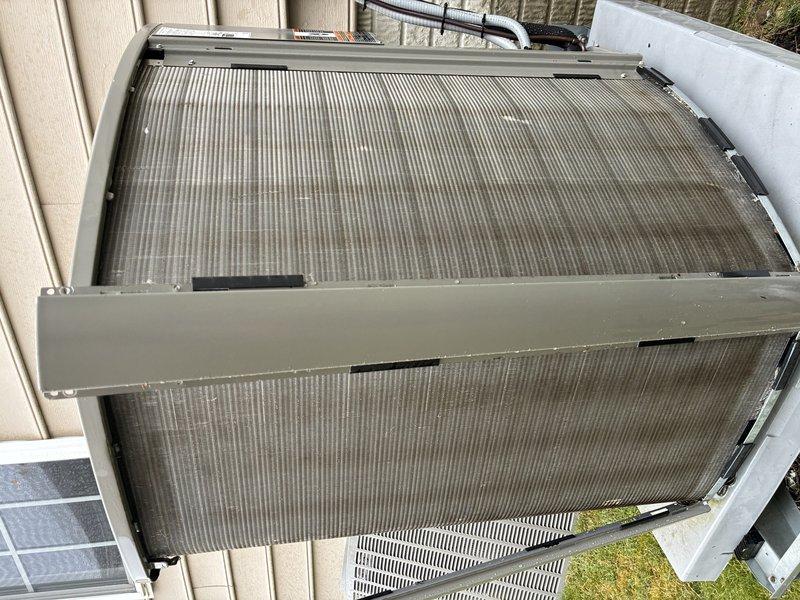Completed preventive maintenance visit on 4-year-old residential air conditioning system. Performed comprehensive inspection of indoor evaporator coil and outdoor condenser unit. Evaporator coil showed normal operational condition with clean fins and proper airflow. Outdoor condenser unit exhibited moderate dirt and debris accumulation on coil fins, which was noted for monitoring. All electrical connections, refrigerant lines, and internal components inspected and found to be functioning within normal parameters. System operating efficiently with no immediate service needs identified.