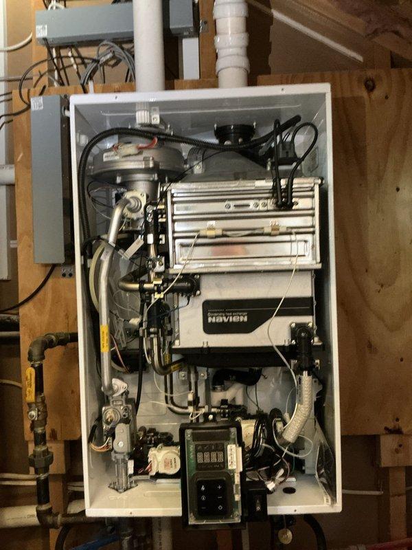 Performed complete flush and fill service on two Navien tankless water heaters to remove mineral buildup and maintain optimal performance. Accessed internal components, circulated descaling solution through heat exchangers, and refilled systems according to manufacturer specifications. Additionally replaced water filter cartridge in customer's existing filtration system per request.